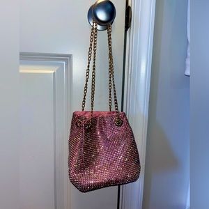Pink iridescent rhinestone bucket bag with gold chain strap